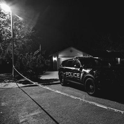 Boise police vehicle behind crime scene tape.