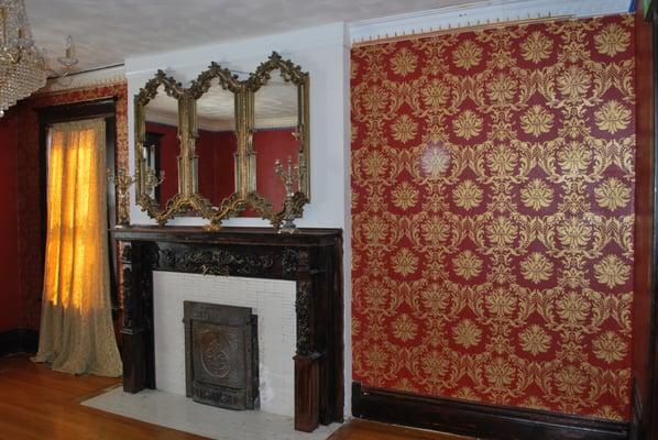 That's not wallpaper! Painted gold damask on red in Historic Denver Home.