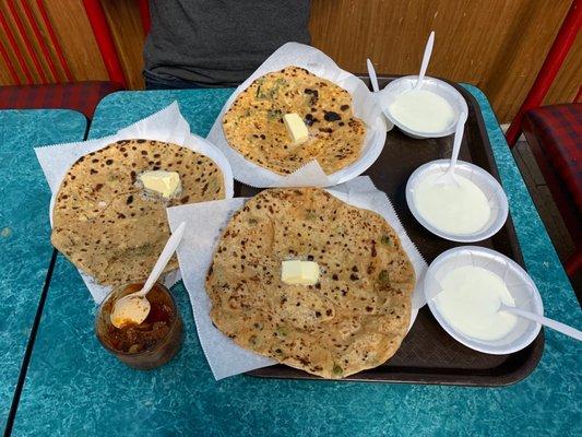 Paneer, Gobi and Aloo paratha .. with tons of butter !!