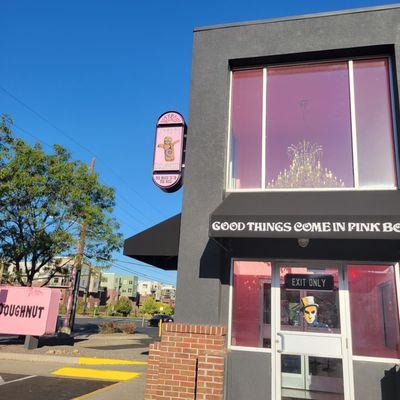 Outside the decidedly gray building of the Boulder Voodoo Doughnuts location.