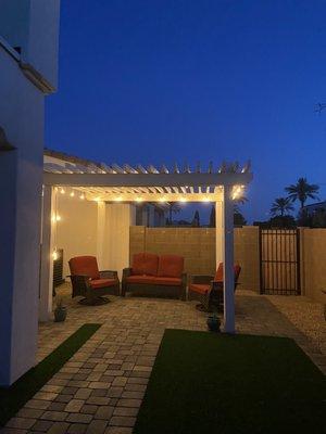 Slate colored pavers with edging for pergola flooring.