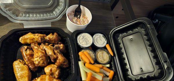 Smoked chicken wings,  coleslaw and carrots and celery with blue cheese that is fantastic and ranch