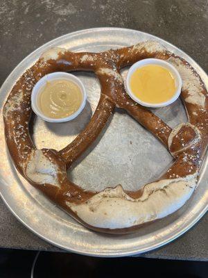 Pretzel with mustard and cheese