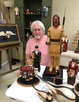 Lee Simpkins and some of his hand carved items in his art studio at the Rockmart Cultural Arts Center