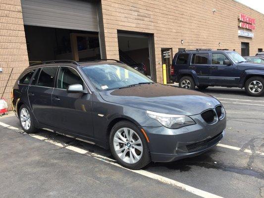 BMW 5 Series Wagon in for replacement of the two right side doors, and a complete nose respray.