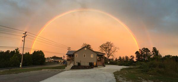 Natchez Trace Realty office under a full rainbow.