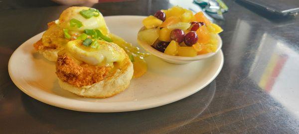 Chicken tender eggs benedict with fruit on the side