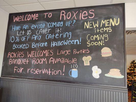 Sign greeting customers and letting everyone know they do catering and have nice banquet room