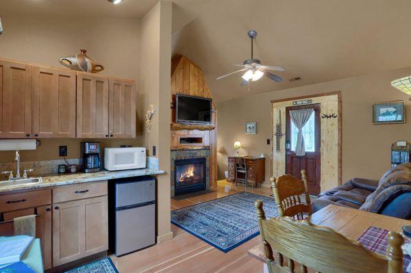 Sitting room, dining area and kitchen area with mini fridge and freezer, coffeemaker and microwave