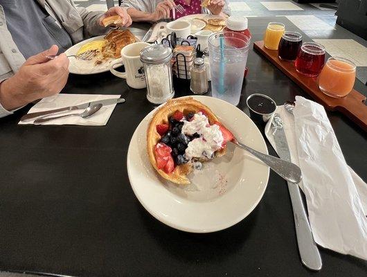 Waffle bowl with fruit and a mimosa flight!