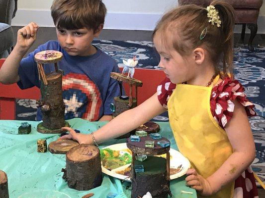 Kids crafting fairy houses at our Nature Warriors Summer Camp