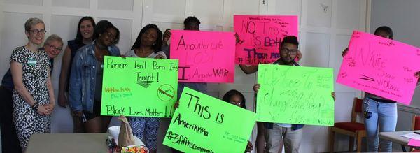 Local high school students create signs for JP's monthly Vigil in Support of Black Lives Matter.