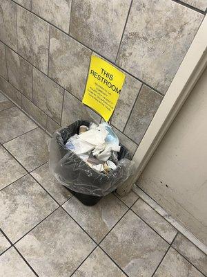 Full trash in bathroom