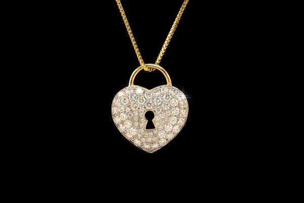 A pendant made from a client's old mass of old jewelry and diamonds, the setting is immaculate.