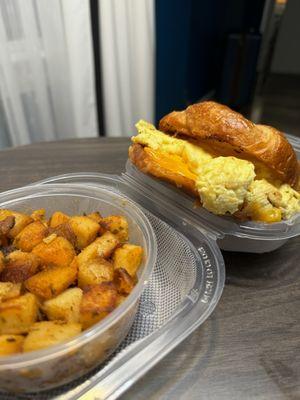 Breakfast potatoes and bacon,egg and cheese croissant