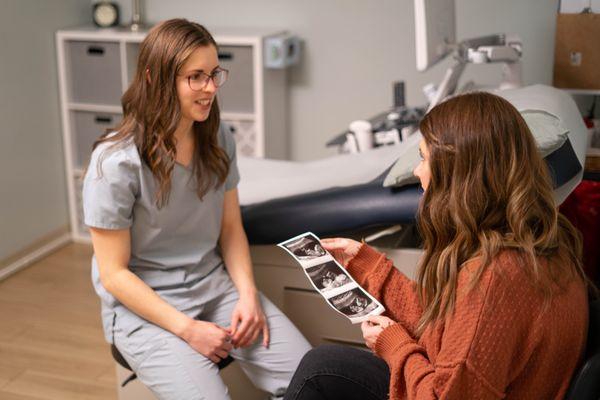 Patient reviewing the results of her ultrasound with a nurse