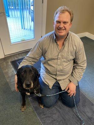 Sally our black lab after her adjustment w the chiropractor - waiting for a treat of course :)