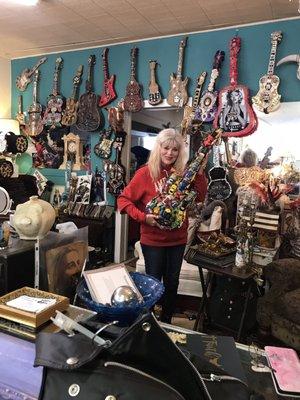 The owner and her artistic guitars.