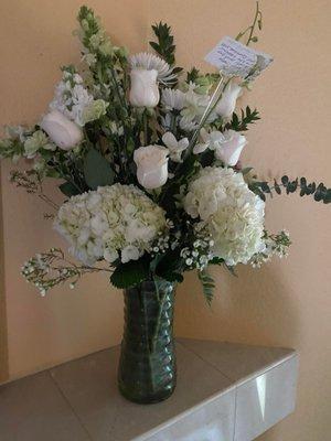 White roses and Mums, I believe. Thank You!!!