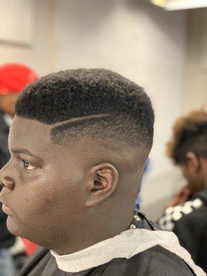 Mid fade with side part.