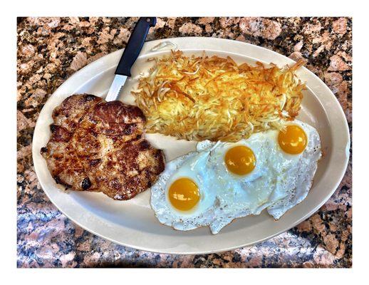 Steak N Egger . Two Boneless Pork Chops w/3 Eggs and Hush-browns & Toasts. & Coffee.  Good Big Meal for 11.10$ Total! Nice & Tasty! Cool!