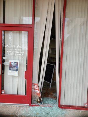 Broken storefront window.