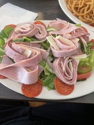 Antipasta salad and you can see the onion rings a little bit top right corner