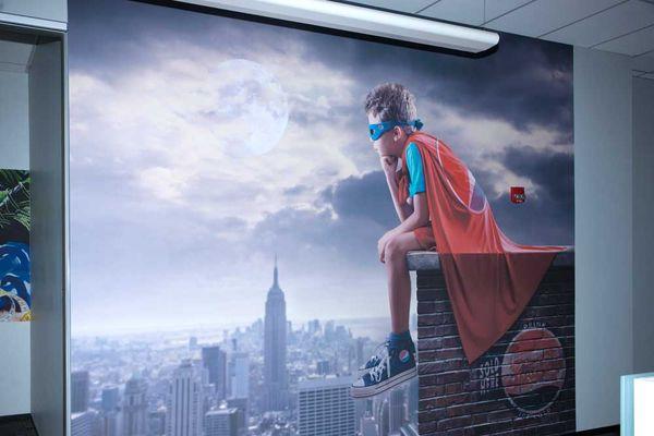 Be a super hero with a large wall mural.