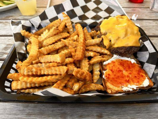 Smash burger with red pepper jelly and cream cheese with fries