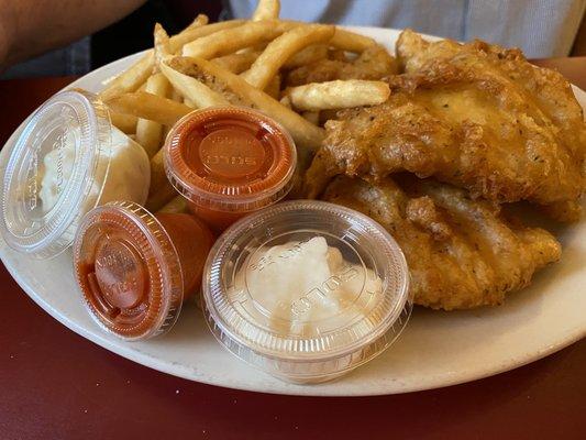 Fish fries tartar sauce and hot sauce