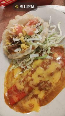 Puffy taco with carne guisada and cheese enchilada