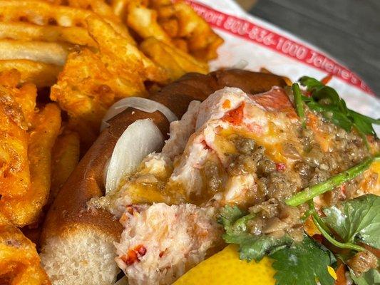 Buttah Lobster roll sandwich and waffle fries