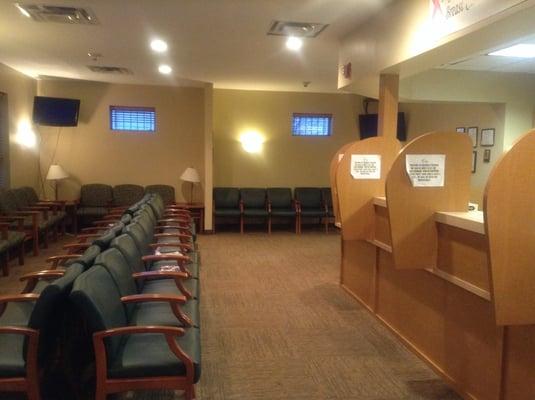 Very comfortable waiting room with two tvs