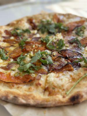 Butternut squash pizza with caramelized, onions, and hot honey