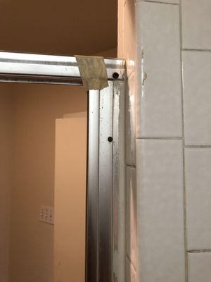 Shower door was taped together