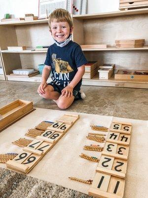 He is feeling so proud! Rocking the 10 board!