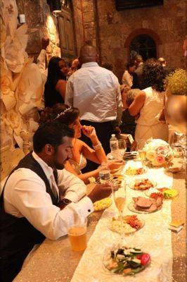 Kaleigh and Trevor enjoying their guests and a meal before the party kicked in