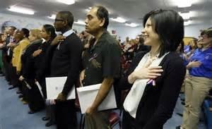 Taking the Oath of Citizenship.  We help our clients navigate the naturalization process.