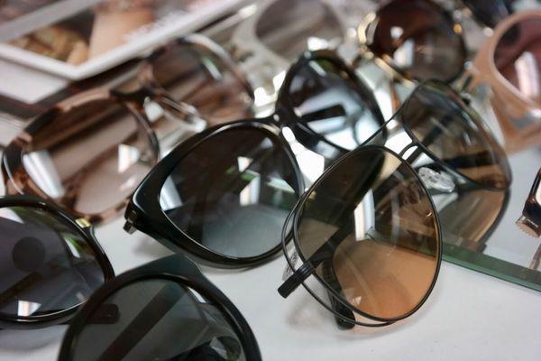 Some glasses and sunglasses frames available for purchase. They're all so sleek and fashionable.