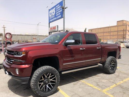 Lifted Silverado 1500 with new rims and tires