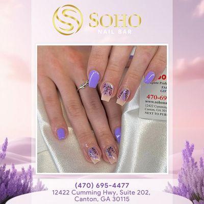 Adorn your nails with beautiful purple and lavender flower art for a look that's both elegant and enchanting!