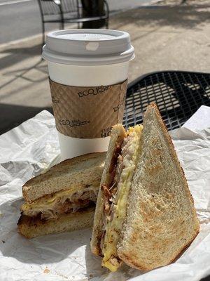 Breakfast sandwich: egg, turkey, Muenster and drip coffee.