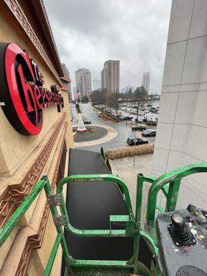 Repairing sign at cheese cake factory