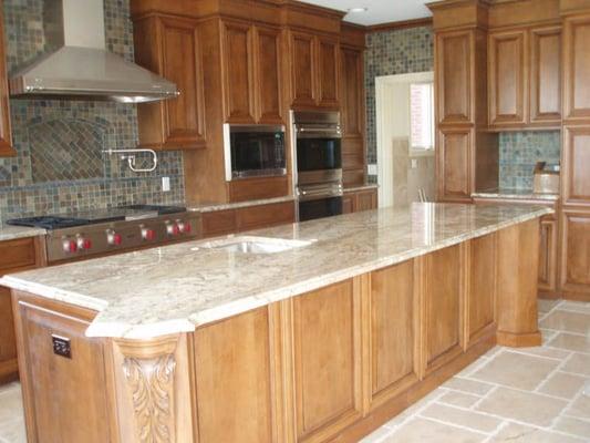 Magma exotic kitchen granite island with ogee edge in Macomb, MI.