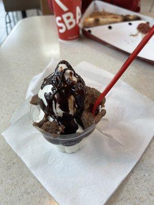 Customized sundae with graham cracker base, marshmallow sauce, and cocoa fudge. Tastes similar to the old school s'more galore.