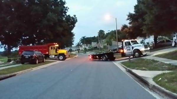 Dump truck stuck in the sand.    Thank you so much for your efforts William and Delilah.