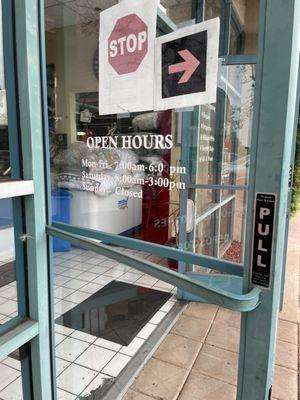 Outside: hours posted on the door