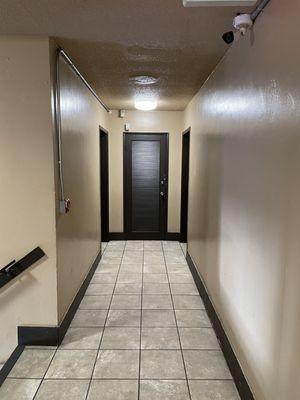 Interior hallway showcasing private indoor room entry.