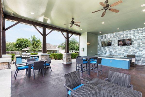 Grand outdoor living area seating near the resort-style pool.