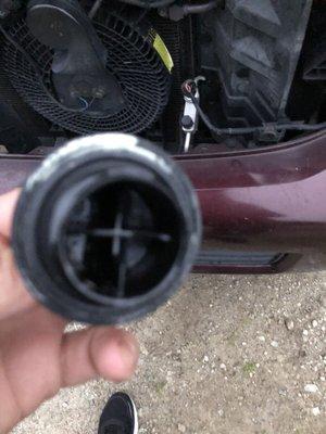 Under the oil fill cap.